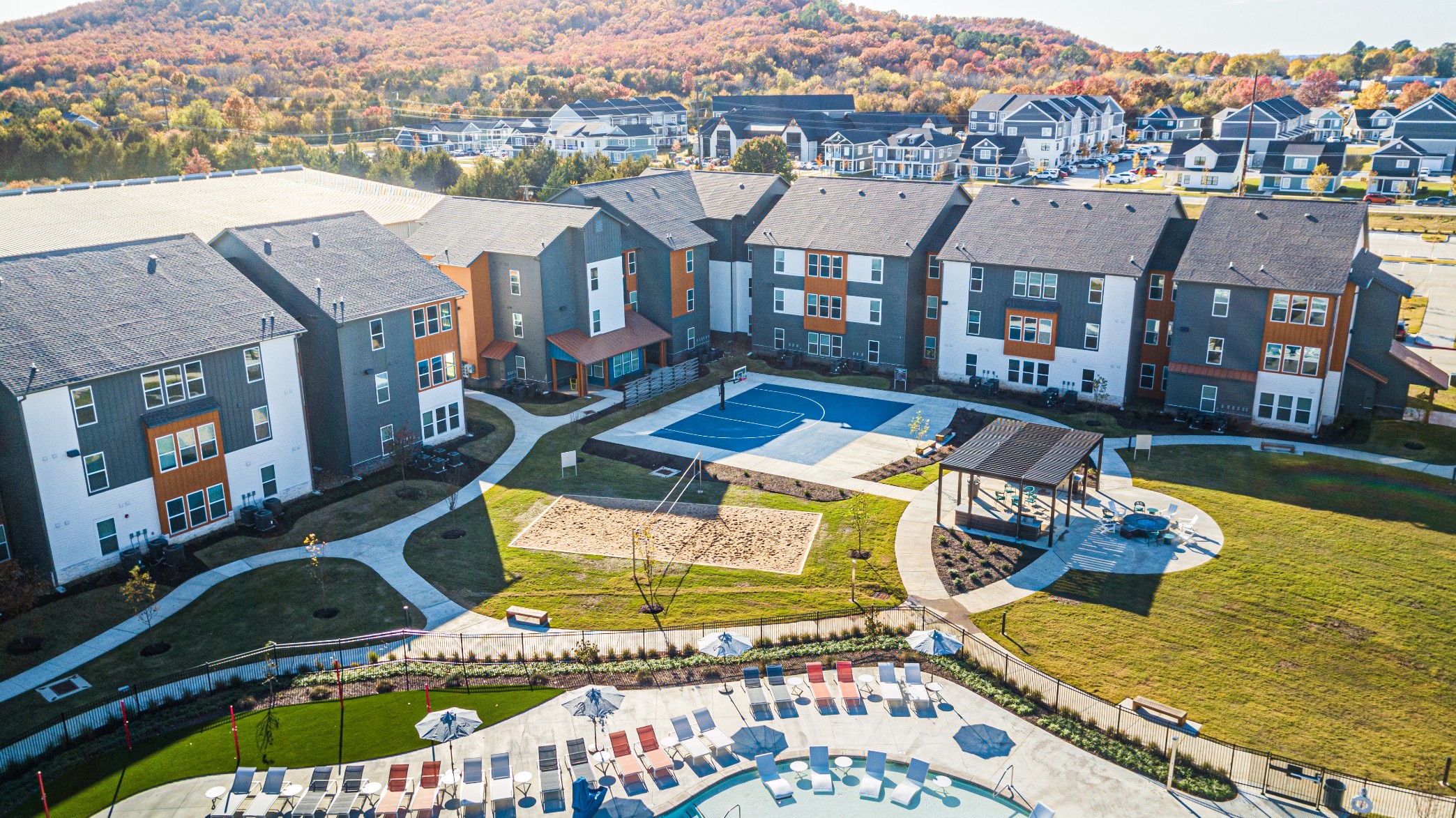 Aerial view of The Tusk apartment community and outdoor amenities