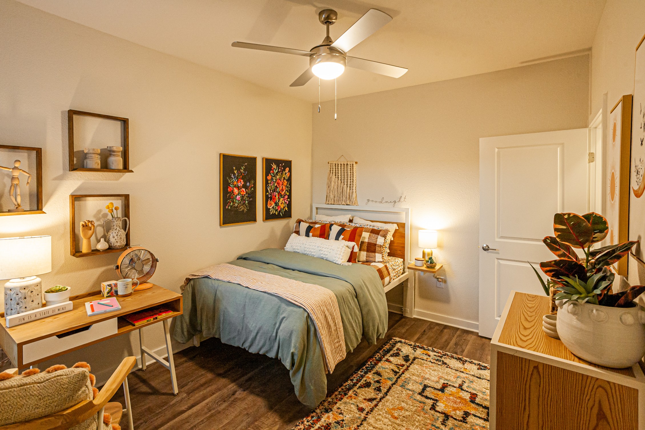 Bedroom with ceiling fan and vinyl plank flooring