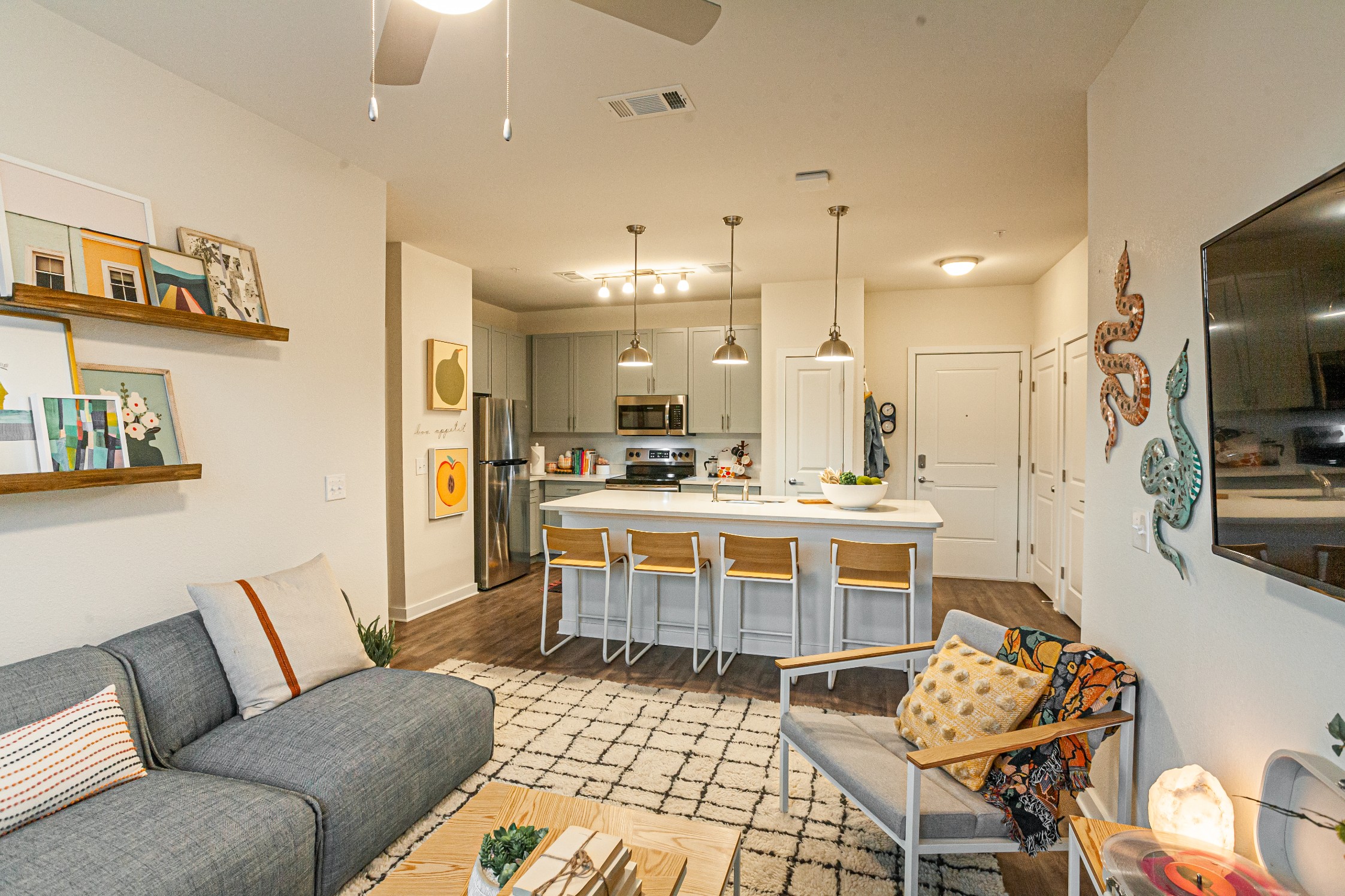 Living room and kitchen of a model student apartment at The Tusk