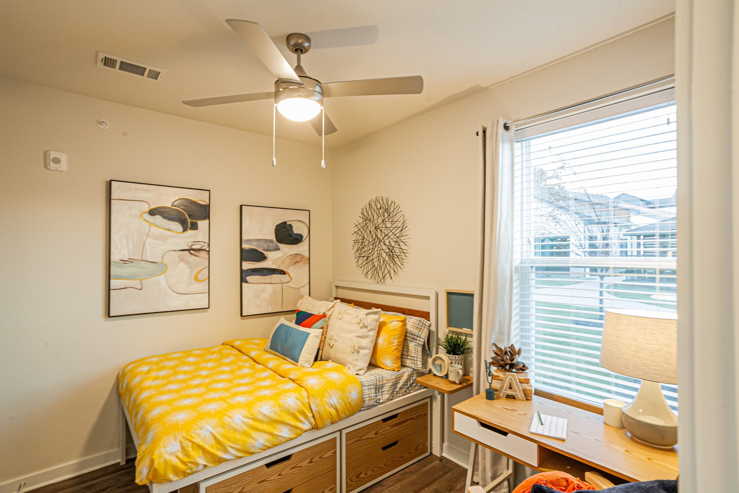 Model bedroom with underbed storage and large window scaled
