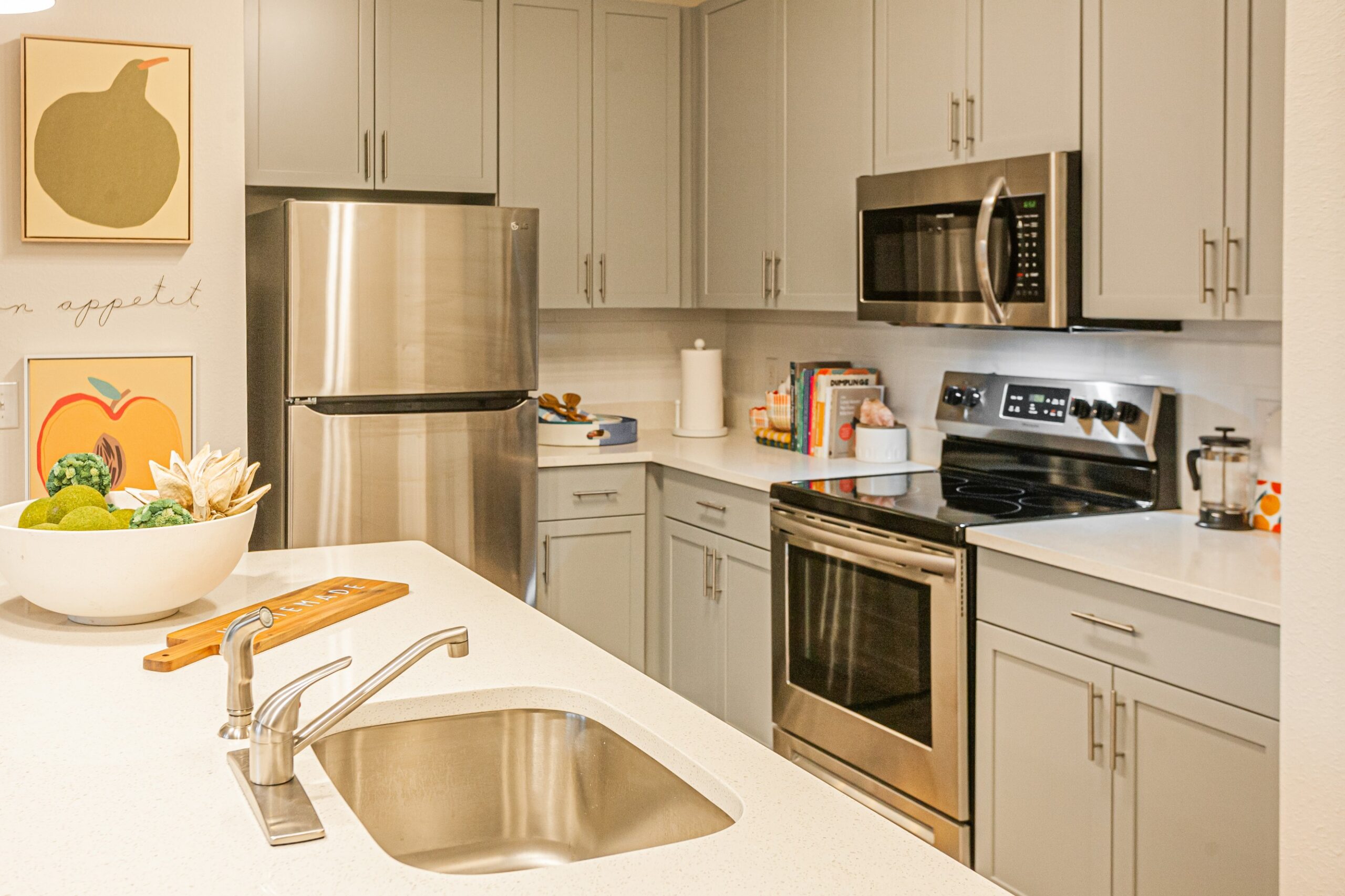 Model kitchen with stainless steel appliances at The Tusk scaled