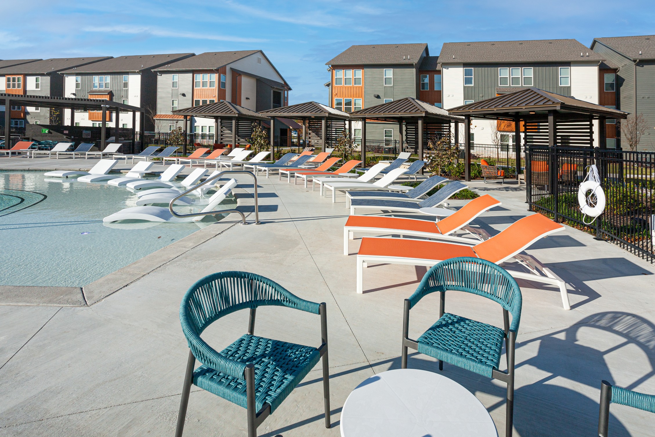 Poolside lounge chairs and cabanas at The Tusk
