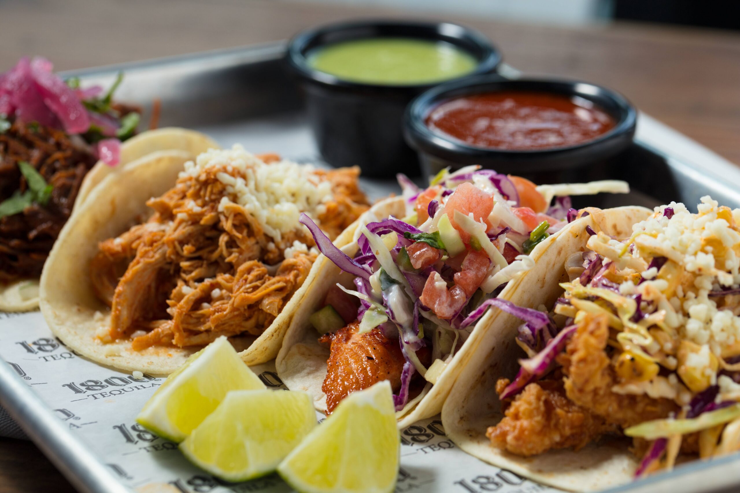 assorted taco platter with salsa cups scaled